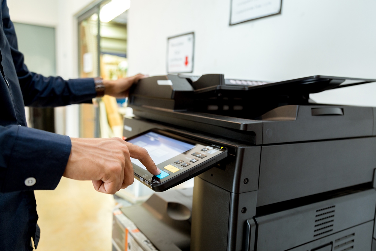 a person using a printer
